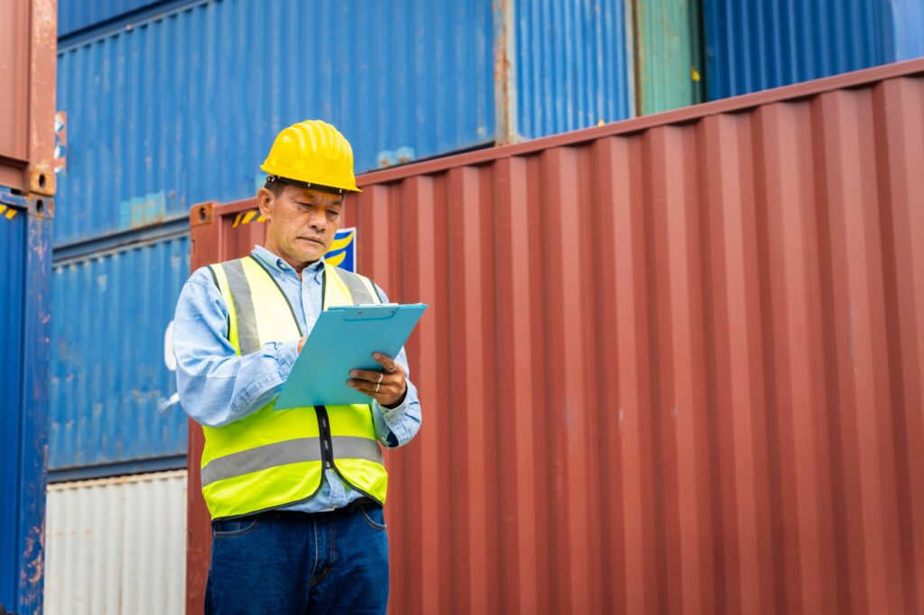 male engineers in a container shipping company Consulting