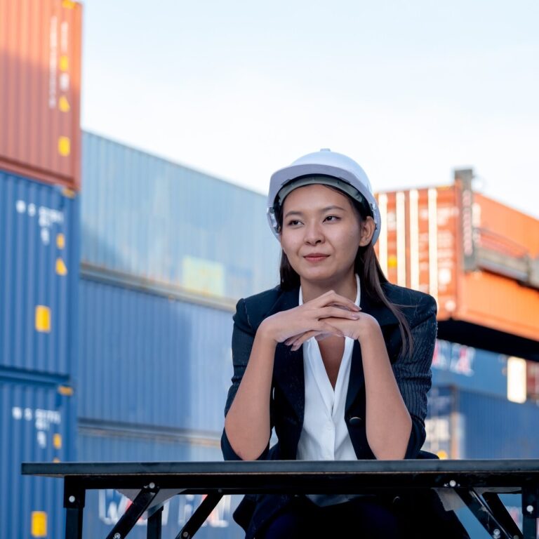Portrait of engineer worker of factory technician with Chinese woman style sit in cargo area